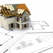 Clipart Illustration of a Partially Built Two Story Home On Top Of Blue Prints